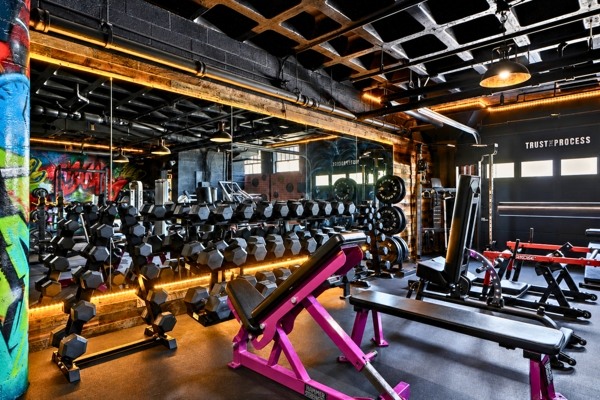 Dumbbell rack, benches and power racks on the BodyByFlo free-weight floor